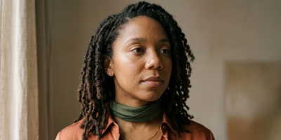 Close-up portrait of a Black woman showing natural beauty and individual style